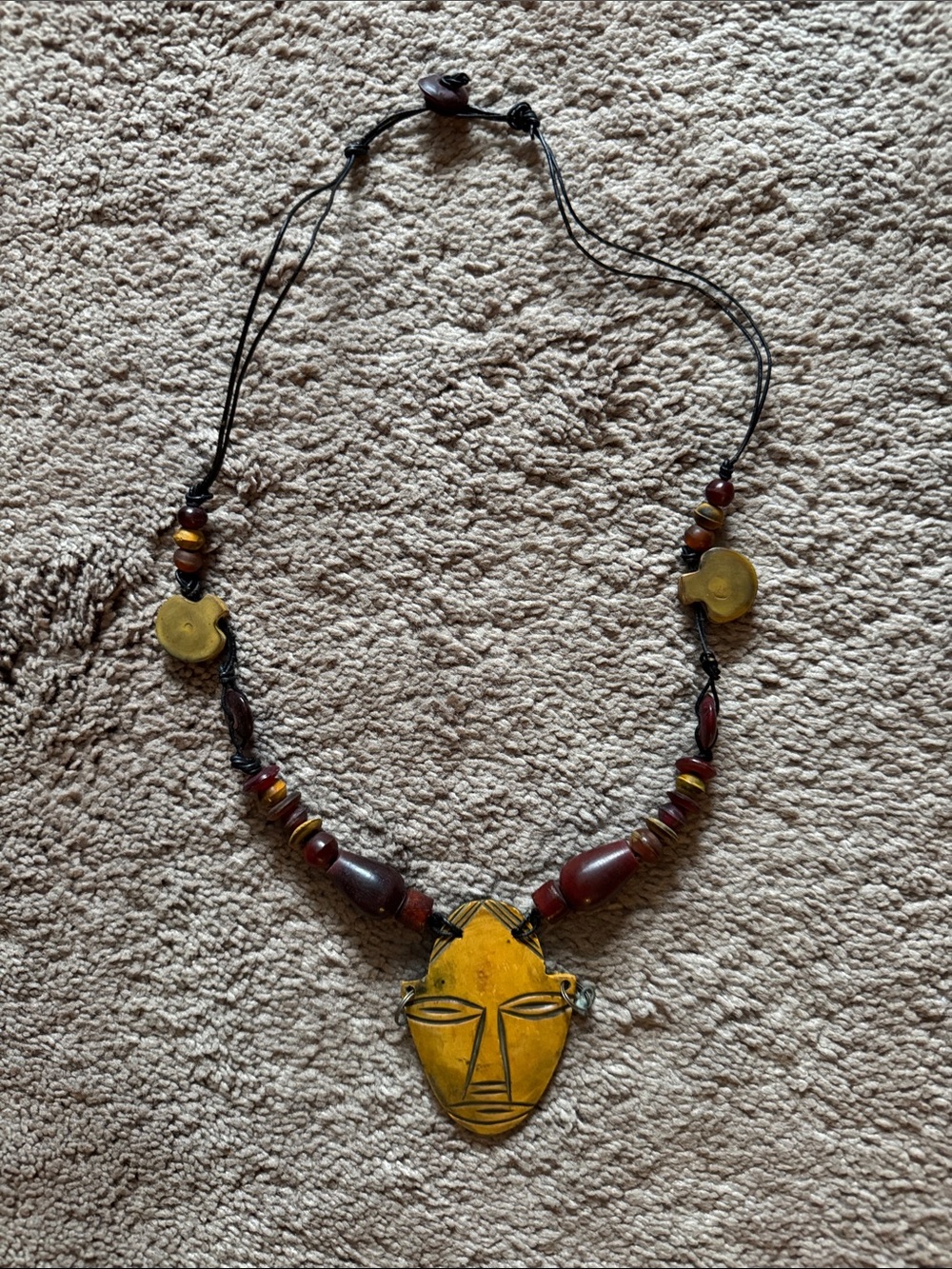 Yellow Tribal Mask Pendant Necklace with Amber Bead Accents